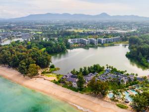 an aerial view of a resort on a beach at Cassia Residence by Metrika, Laguna Phuket in Laguna Phuket