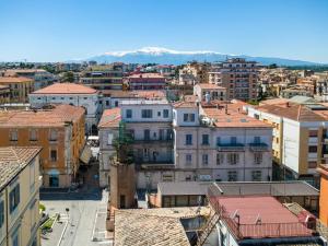 an aerial view of a city with buildings and mountains at Bandiera Urban House in Lanciano