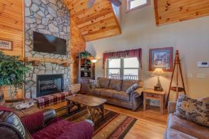a living room with a couch and a fireplace at New River Ramble in Todd