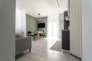 a living room with a couch and a table at Bandiera Urban House in Lanciano