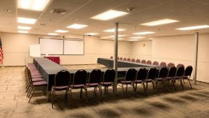 a conference room with a long table and chairs at The Green Granite North Conway, an Ascend Collection Hotel in North Conway +68 photos