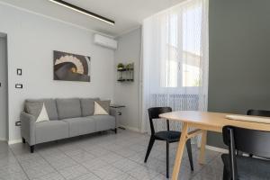 a living room with a couch and a table at Bandiera Urban House in Lanciano