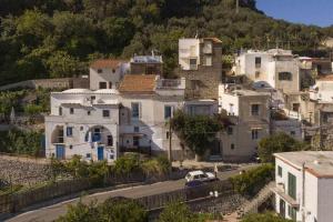 a group of white houses on a hill at The Sirens House in Nerano