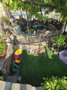 an overhead view of a miniature garden with a toy car at Lithos Home in Panagia