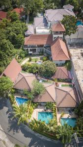 an aerial view of a resort with swimming pools at Orchid House Pattaya, Totally Private Pool in Pattaya South