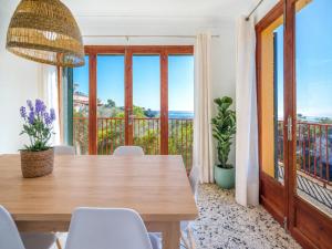 a dining room with a table and views of the ocean at G398 Ses Savines by Mallorca Villa Selection in Santanyi