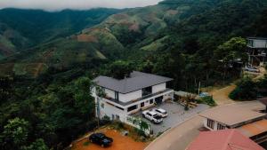 an aerial view of a house in the mountains at Mei Nai Home เมย นาย โฮม in Ban Sakat Nua