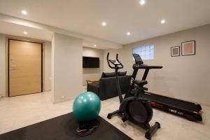 a living room with a gym with a exercise ball at Efilenia Luxury Villas in Corfu +36 photos