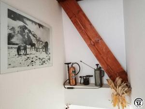 a wall with a picture of animals on the wall at Montmajou in Cier-de-Luchon