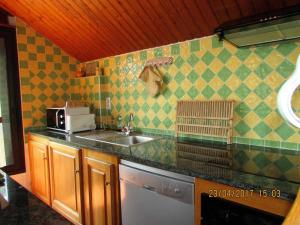 a kitchen with a sink and a counter top at Montmajou in Cier-de-Luchon