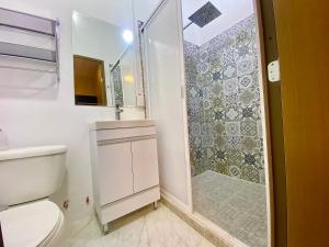a bathroom with a shower and a toilet at Casa Regina CDMX in Mexico City +45 photos