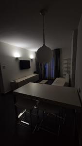 a room with a table and chairs and a couch at Casa Mia in Cosenza