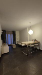 a room with a table and a bed in it at Casa Mia in Cosenza