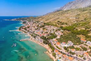 an aerial view of a town on the beach at LUXURY VILLA PARADISE 120m from sandy beach, heated pool, billiard, max 12 pax in Duće
