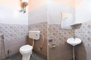 a bathroom with a toilet and a sink at Hotel O Eastern Crossway Siliguri Formerly Utsho in Siliguri