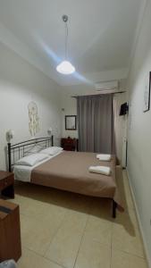 a bedroom with a bed in a room at Hotel Trifylia in Kyparissia