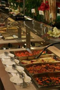 a buffet line with many different types of food at Hotel Gran Rey in Valle Gran Rey