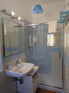 a bathroom with a sink and a shower at Helimos B&B with Segesta Temple view near Castellammare del Golfo in Calatafimi