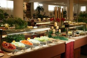 a buffet line with many bowls of food on it at Hotel Gran Rey in Valle Gran Rey