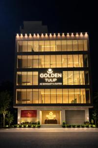 a building with a sign that reads golden rule at Golden Tulip Peddapally in Peddapalli
