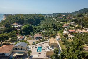 an aerial view of a small village with houses and a pool at Casa Di Mare - Studios and Apartments with pool on the beach, by ZanteWize in Vasilikos