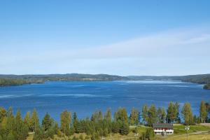 a view of a lake with a house at Halsmo 6 in Kil +7 photos