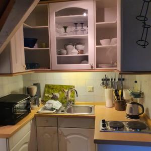 a kitchen with a sink and a counter top at Ferienappartment Op n böhn in Nordstrand