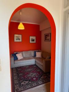 an archway in a living room with a couch at Art & Motion Union - Guest Room 3 in Apoíkia