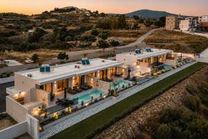 an aerial view of a large white house at Celeste Luxury Villas in Lartos