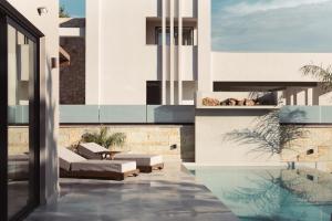 a rendering of a house with a swimming pool at Orien, Seaside Luxury Villa in Argassi