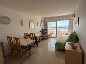 a living room with a view of the ocean at AwayDays - Apartamento en la 7a planta vista mar! in Empuriabrava