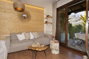 a living room with a couch and a table at El Mirador by BeValle in Panticosa