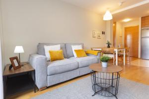 a living room with a couch and a table at Senda by BeValle in Panticosa