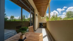 a balcony of a house with a table on it at Qinxiang Pavilion Hotel in Dunhuang