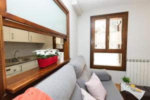 a living room with a couch and a sink at Casa de La Laguna by BeValle in Panticosa