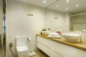 a bathroom with two sinks and a mirror at El Rincón del Verde by BeValle in Panticosa +21 photos