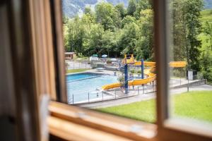 a view of a swimming pool from a window at Egg'spresso Gipfelglück in Egg