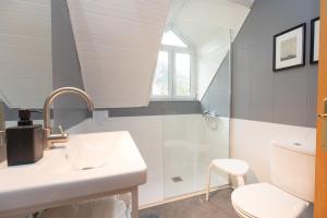 a bathroom with a sink and a shower at Panorámica del Valle II by BeValle in Panticosa