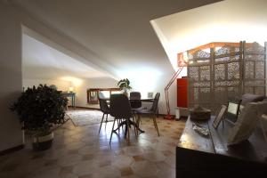 a living room with a table and chairs at Stanza del Cerro in Aranova +30 photos