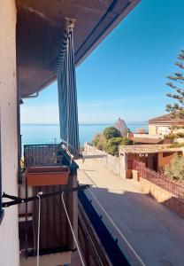 a balcony with a view of the ocean at DaMa s Apartment on the beach in Giardini Naxos +58 photos