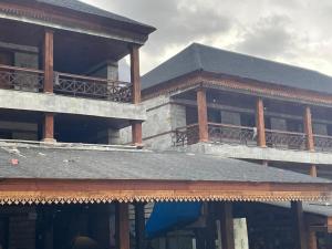 a large building with balconies on top of it at Kedarnath Aastha Path ME5 Building in Kedārnāth