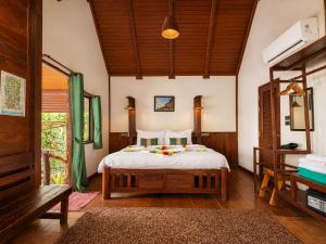 a bedroom with a bed in a room at Ting Rai Bay Resort in Ko Jum