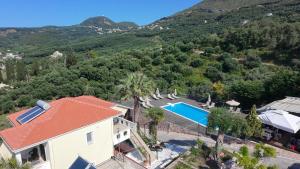 an aerial view of a house with a swimming pool at Diogenis Parga Studios in Parga