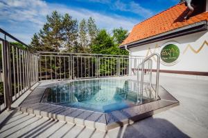 a swimming pool on the deck of a house at Park Hotel Kur & Spa in Świeradów-Zdrój