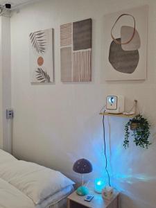 a bedroom with a bed and a table with a lamp at 스테이149 in Hyomoktong-Ilgu