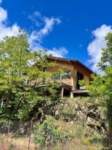a house on the side of a hill at Chalet 6 personnes ou studio 2 personnes in Ax-les-Thermes
