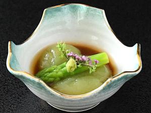 a bowl of soup with a plant in it at Hotel Daisen Shirogane in Daisen