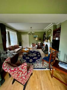 a living room with a couch and a table at Muxnaw Lodge in Kenmare