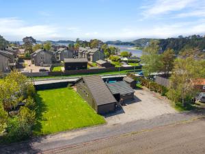 an aerial view of a house with a lawn at Beach cottage in Søgne in Kristiansand