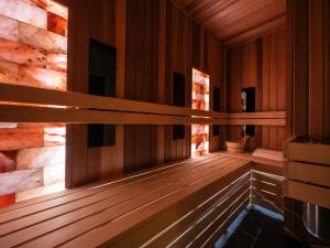 an empty sauna with wooden walls and wooden floors at Boulevard Drobnera SPA&Wellness - Restaurant PONTI - Widok na Odre in Wrocław
